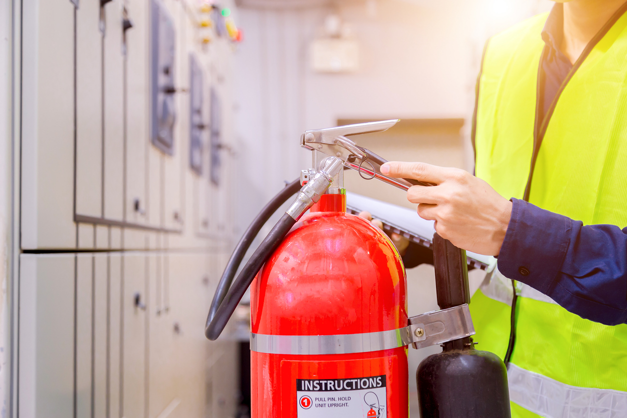 Engineer inspection Fire extinguisher in control room.