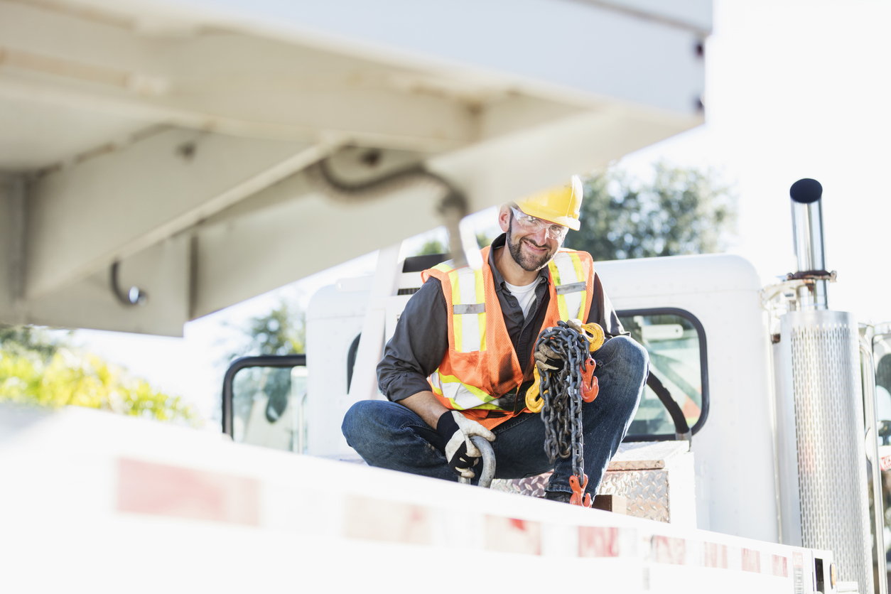 Construction worker on the bed of a crane