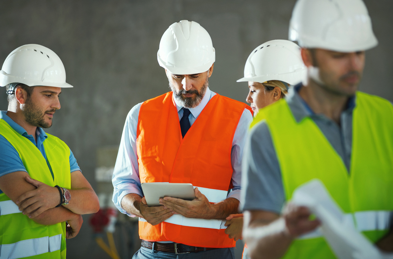 Construction engineers having a meeting inside the building.