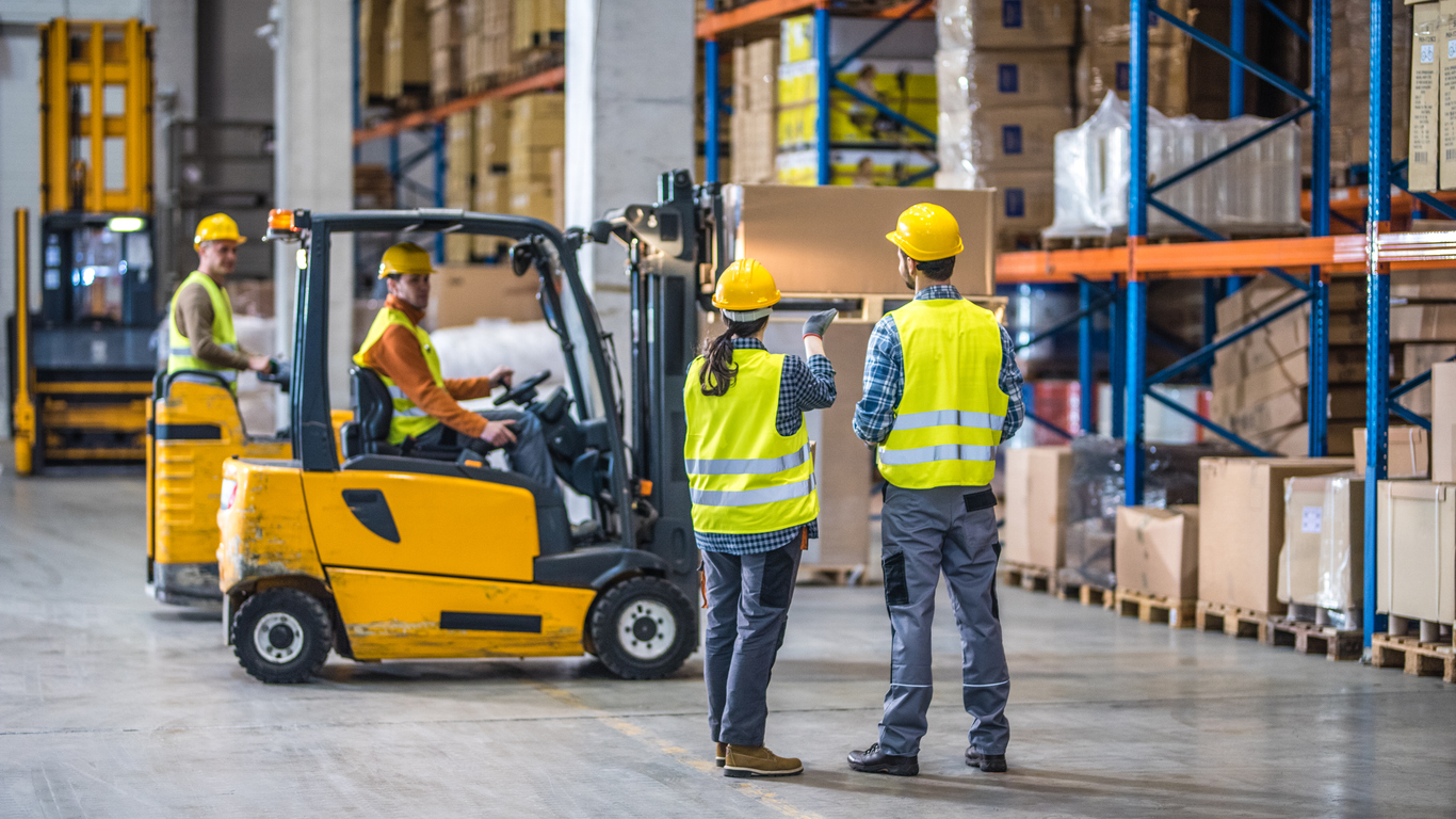 Manual workers working in warehouse